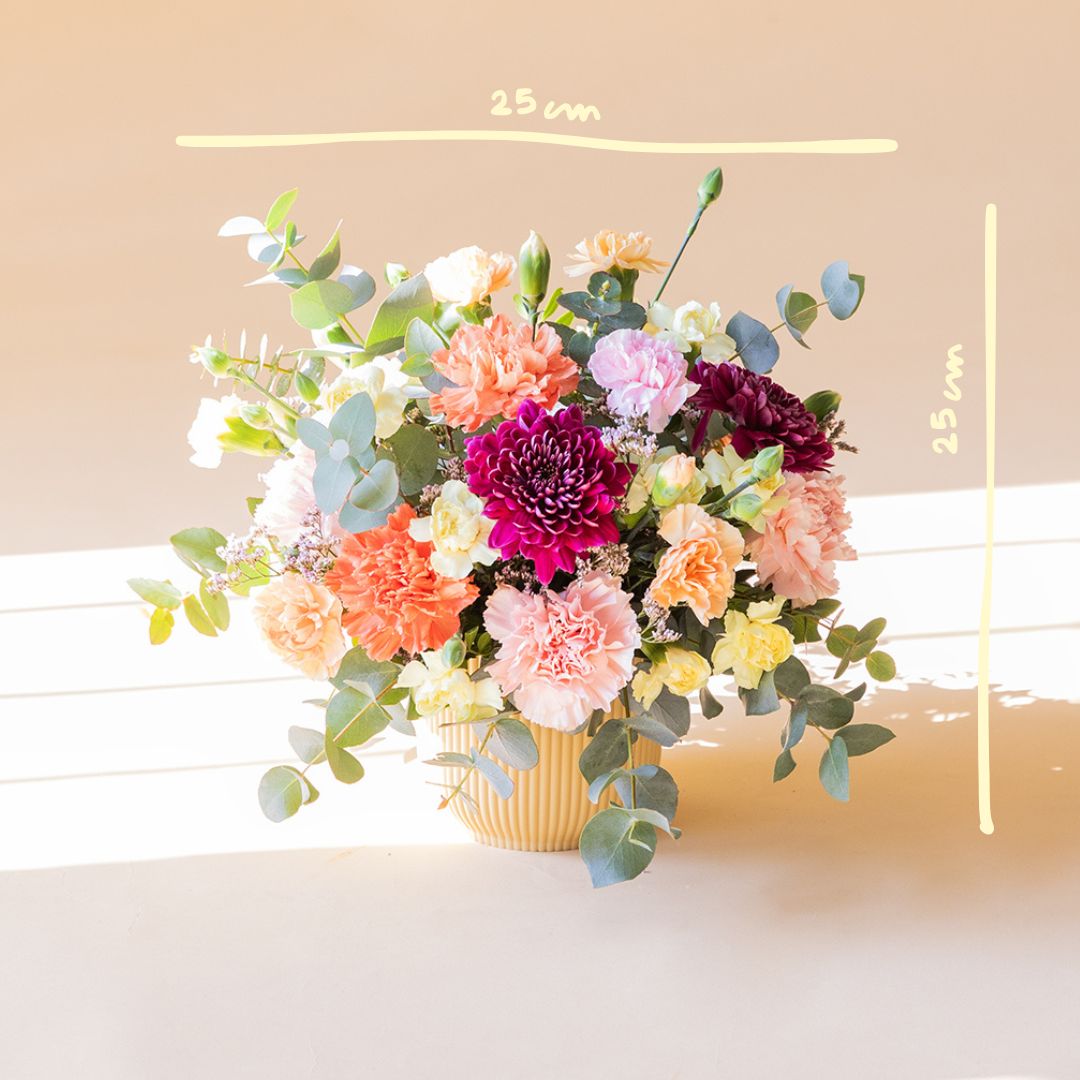 O Faísca - Arranjo com flores amarelas e laranjas