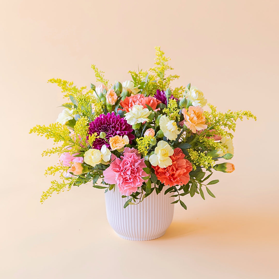 O Faísca - Arranjo com flores amarelas e laranjas