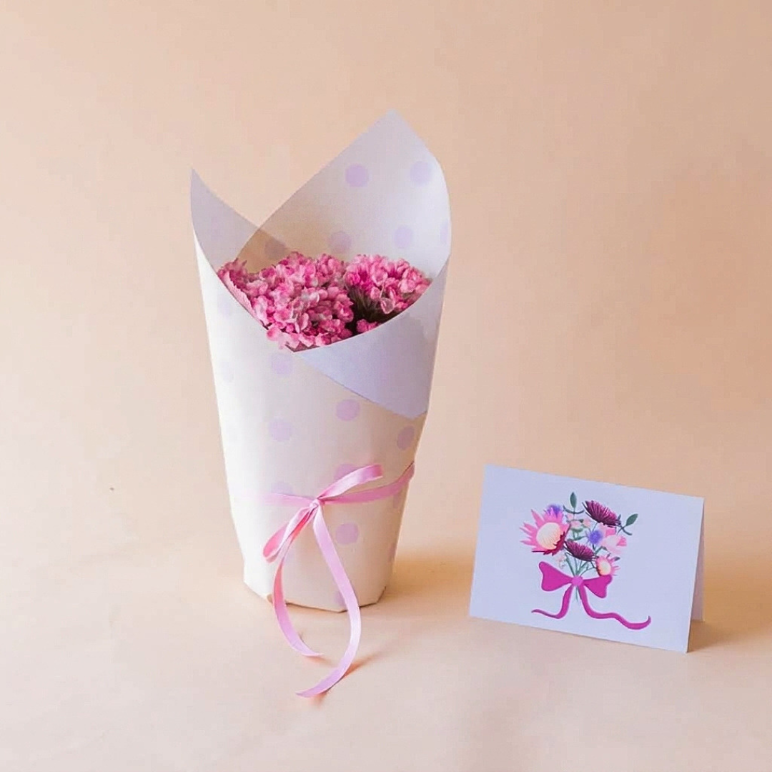 Mini hortensia rosa envuelta en papel lunares con lazo rosa y tarjeta protea floral, regalo a domicilio - Colvin